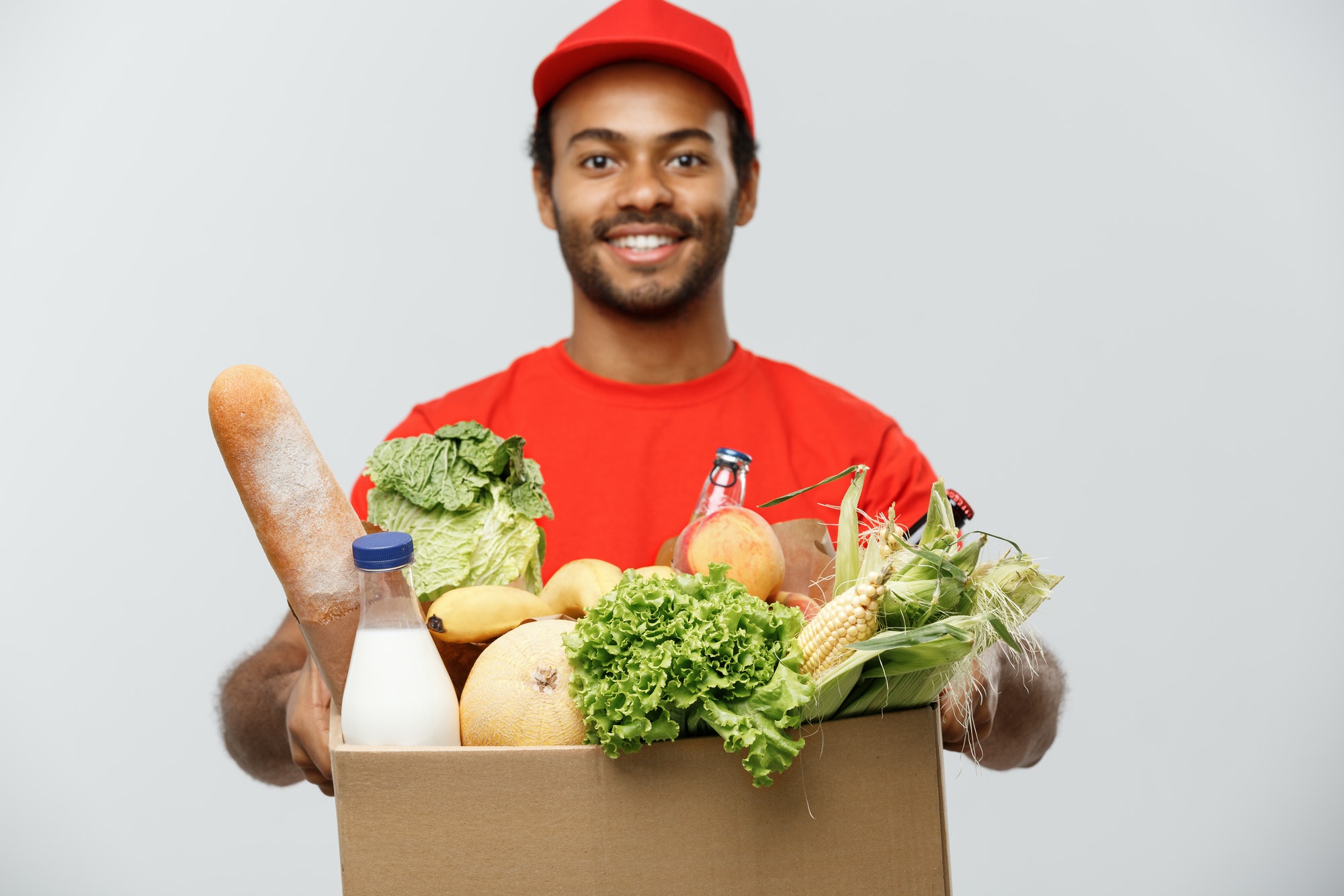 delivery-concept-handsome-african-american-delivery-man-carrying-package-box-of-grocery-food-and.jpg